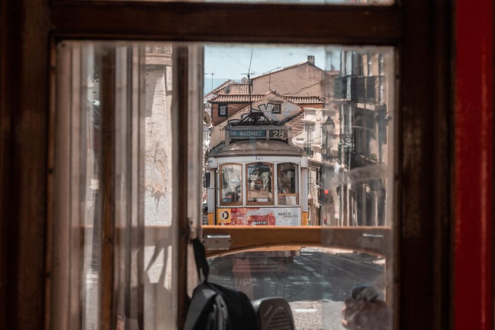 lisbon tram 28 through window on a 4 day itinerary