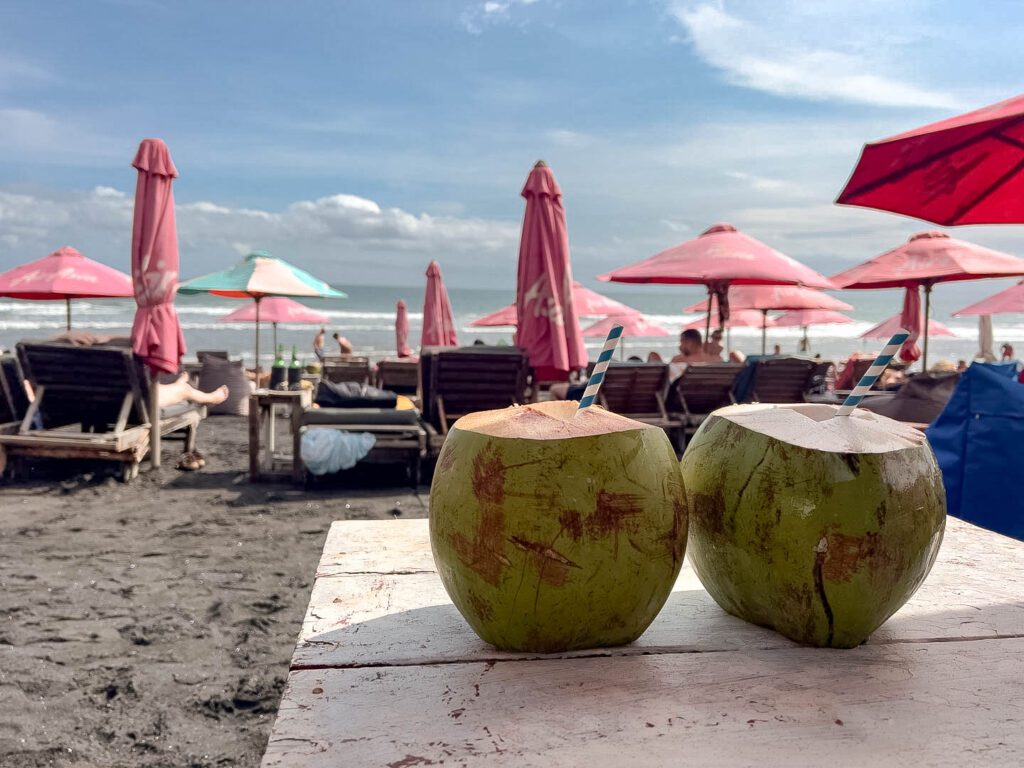 Walk from Seminyak to Canggu Beach coconuts umbrellas sun