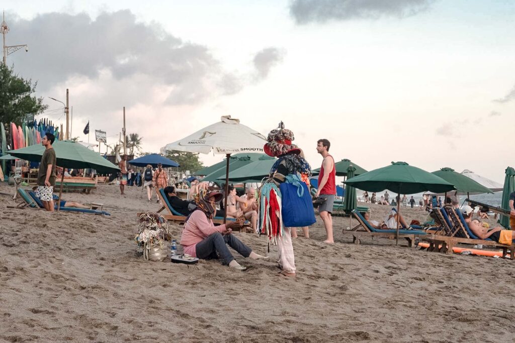 Seminyak beach vendors sarong selling