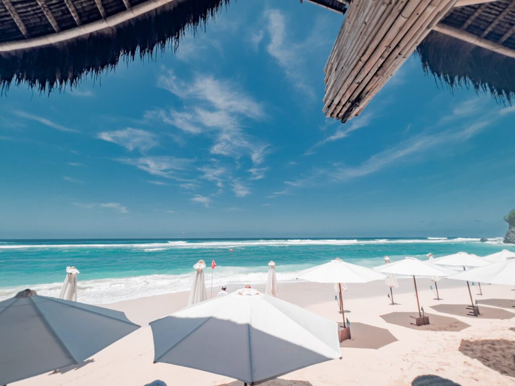 bali beach club sundays white umbrella blue ocean sky