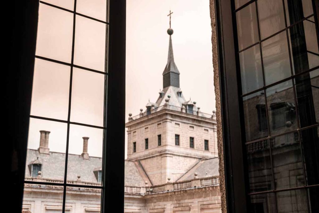 window view of tower monastery smoky sky