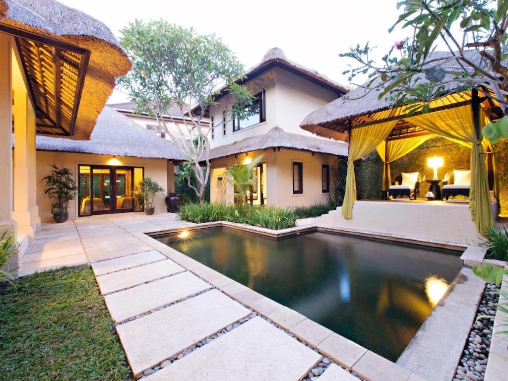 Villa with private pool decorated in Balinese style with an outdoor lounge 