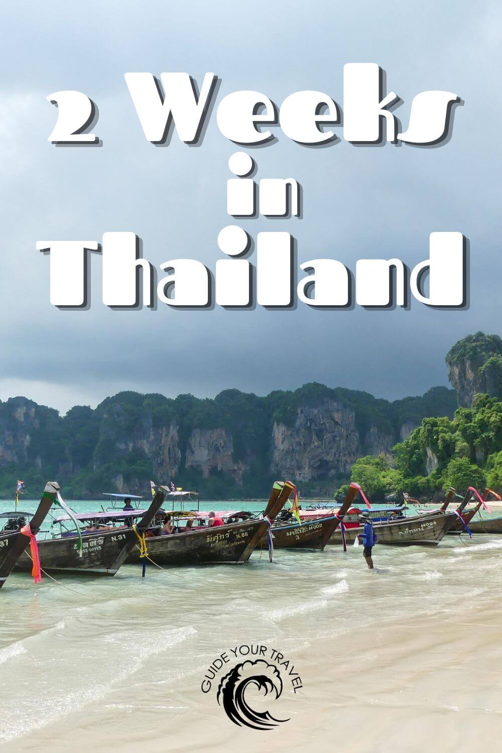 2 week island hopping itinerary thailand boats on white sand beach