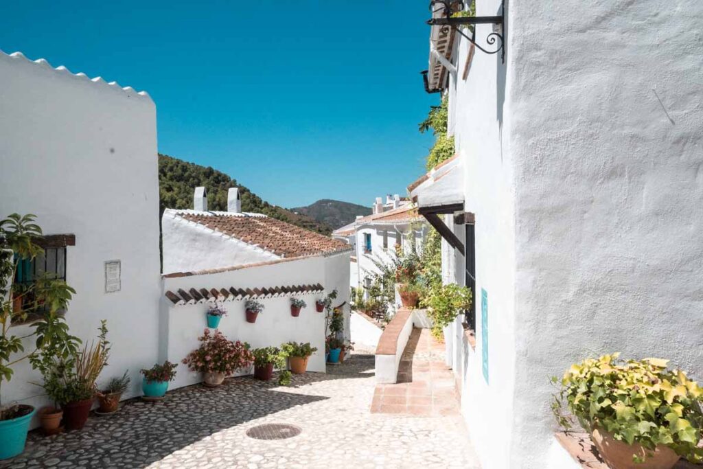 the lost town of el acebuchal in the mountains of spain close to nerja and frigiliana with blue sky and white houses