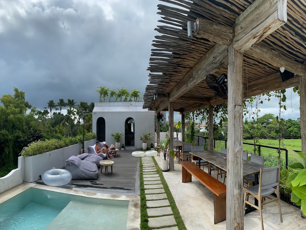 one of the best coworking spaces in canggu with a swimming pool, views over the rice paddies and large tables