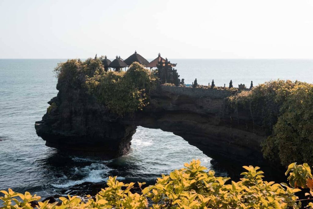 temple next to tanah lot temple with yellow leaves