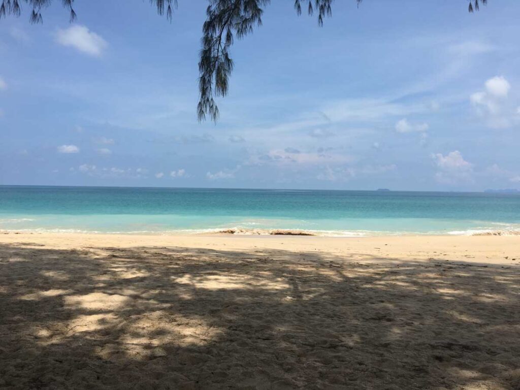 white sand beach in thailand with blue ocean