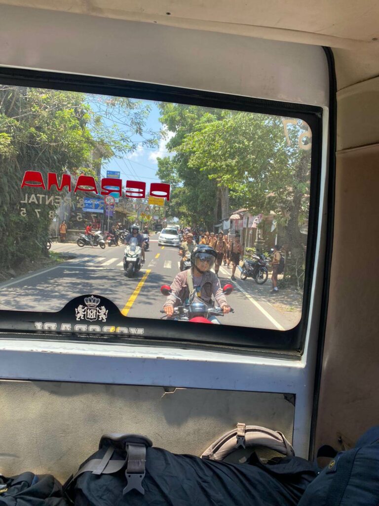 inside of perama bus in bali back window 