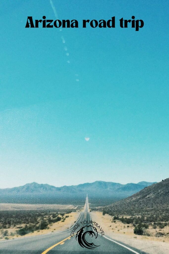 road in the desert with a blue sky 