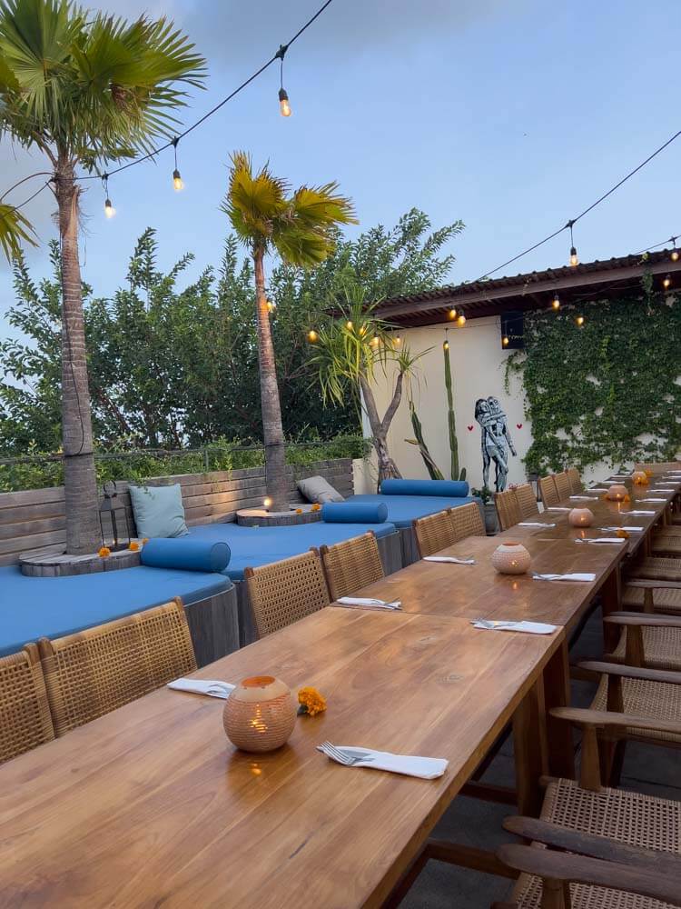 Zin cafe rooftop table with blue couches and set table