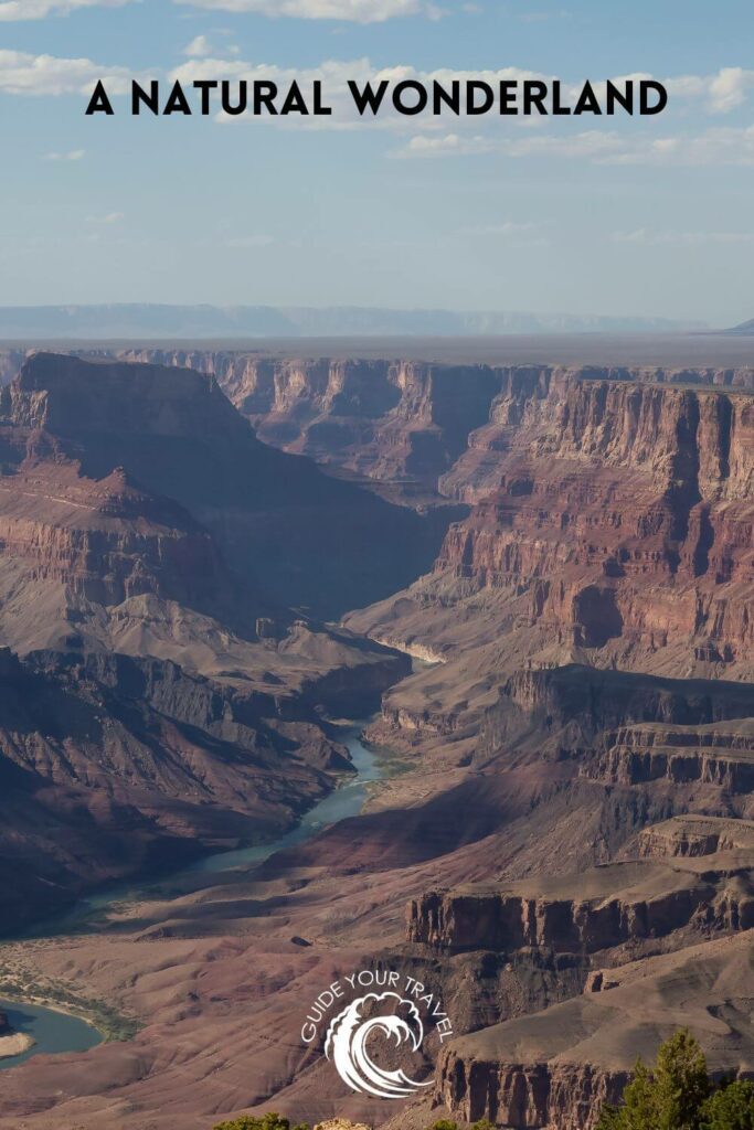 Aerial view of the Grand Canyon with a view of the Colorado River and the sky