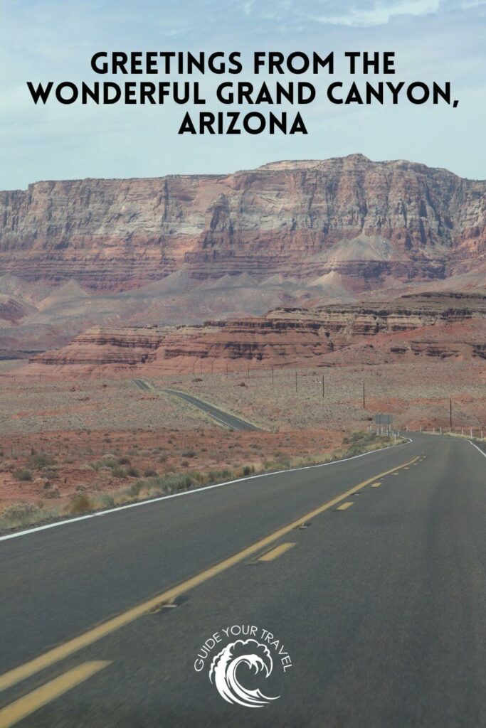 Roadway going toward a mesa among dramatic desert landscape at the Grand Canyon in Arizona