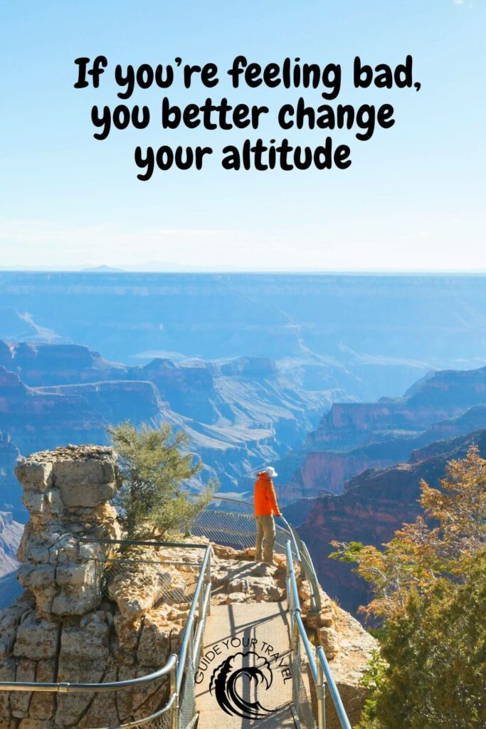 hiking the Grand Canyon with a man wearing an orange jacket from the back 