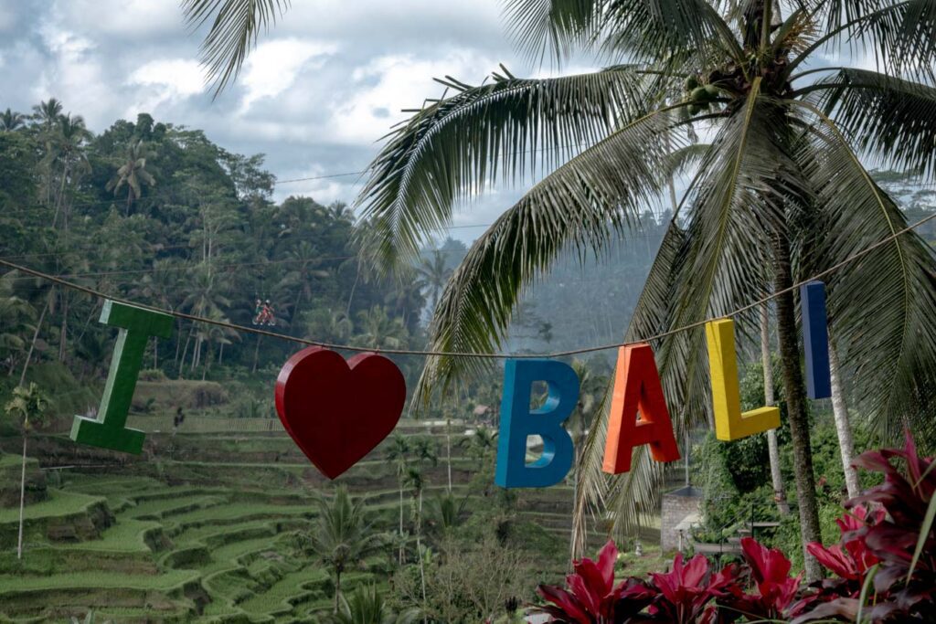 colorful i love bali sign at tegallalang rice terraces in ubud digital nomads