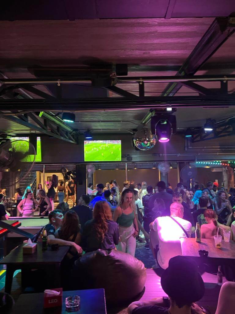 krabi ao nang nightlife bar club with pink lights and people dancing dj