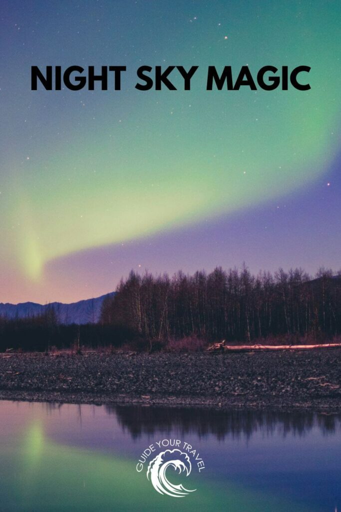 Aurora borealis across a starlit sky above a dark forest. Alaska instagram captions and quotes