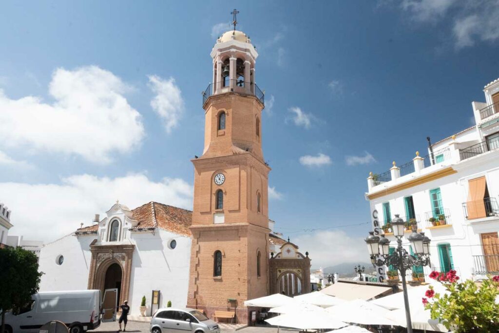 plaza almijara competa spain blue sky church