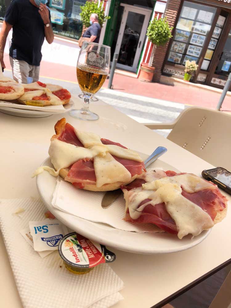 spanish tapas at a bodega cheese tomato and ham