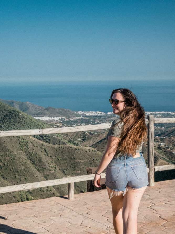 victoria from guide your travel walking at puerto collado in competa spain with blue sky