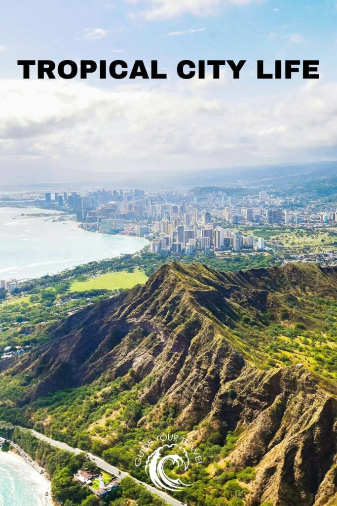 drone shot of green mountains and ocean