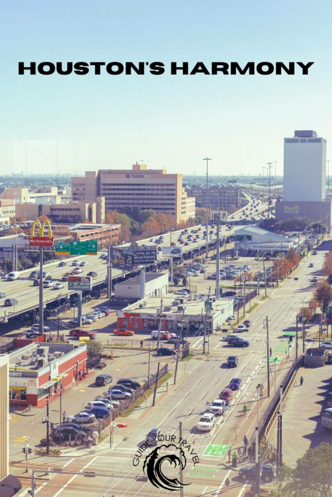 A bustling street scene with traffic and buildings in Houston. houston instagram captions and quotes