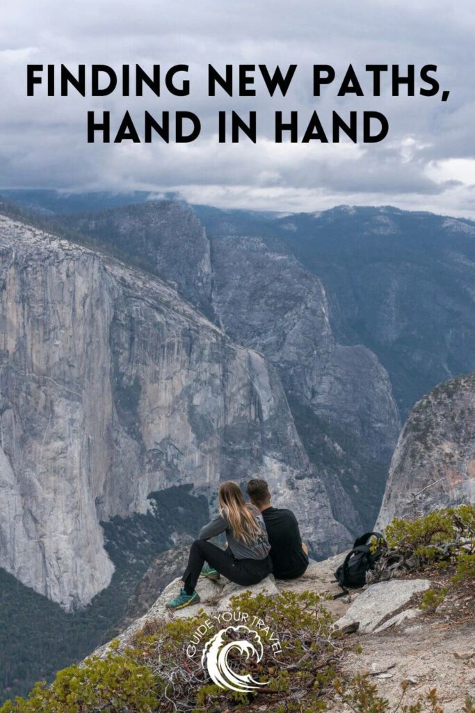 A couple sit on a rock overlooking a mountain valley. Yosemite Instagram captions and quotes