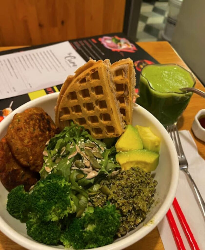 the cure health kitchen canggu green bowl with waffles vegan food cafe