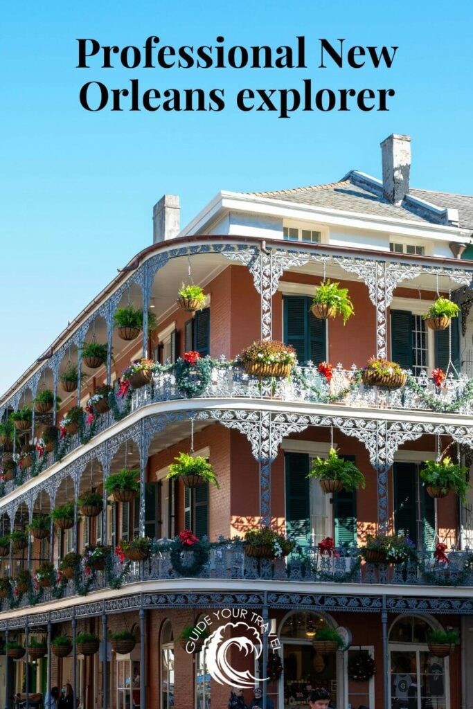 A building with intricate ironwork and hanging plants perfect for New Orleans Instagram captions and quotes