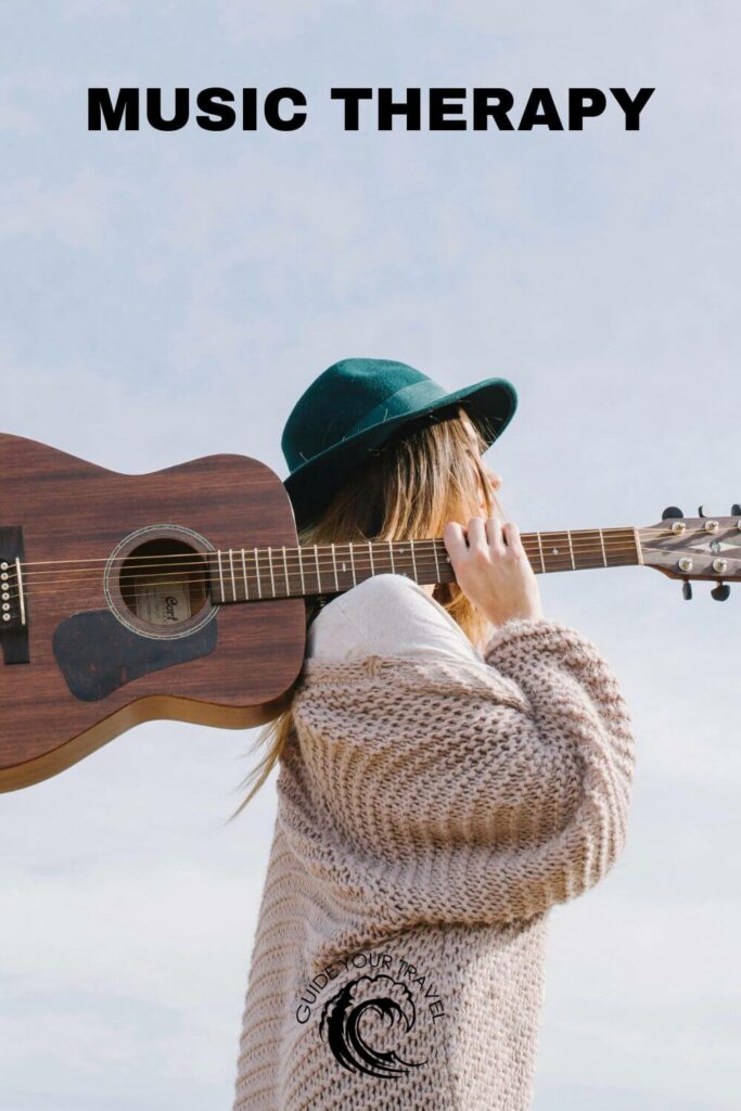 A person carrying an acoustic guitar with the best two-word instagram captions