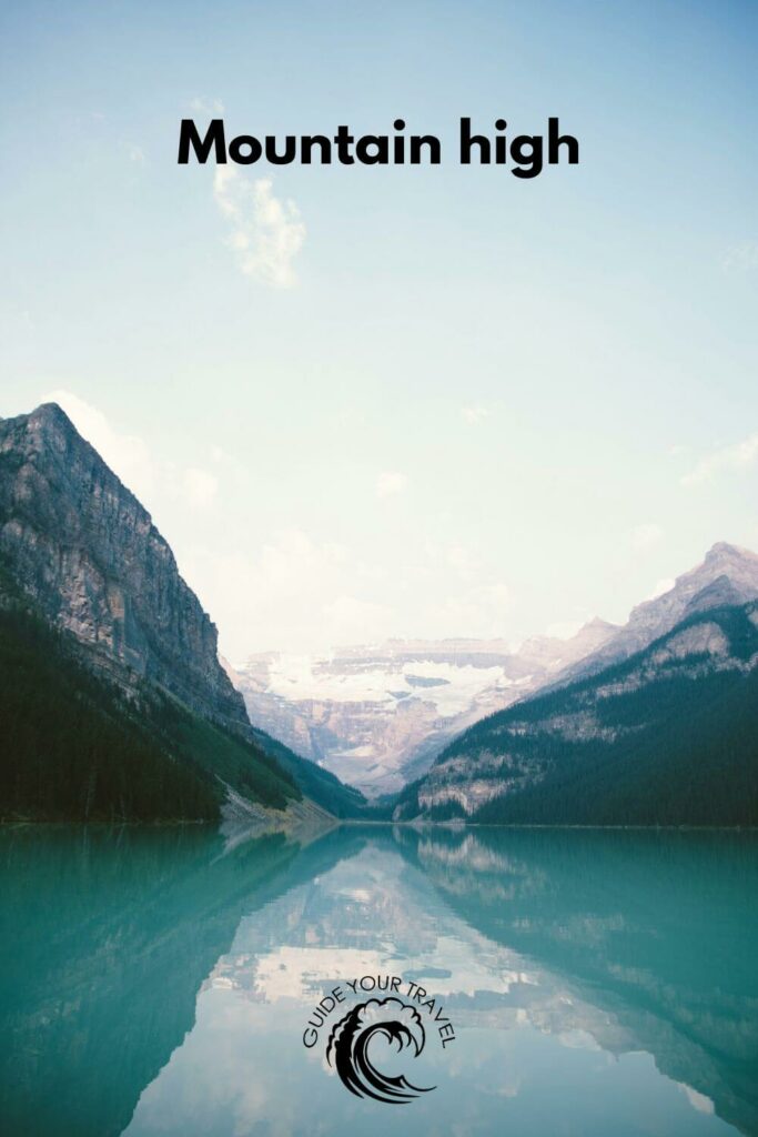 Snow-capped mountains reflected in a lake with the best two-word instagram captions