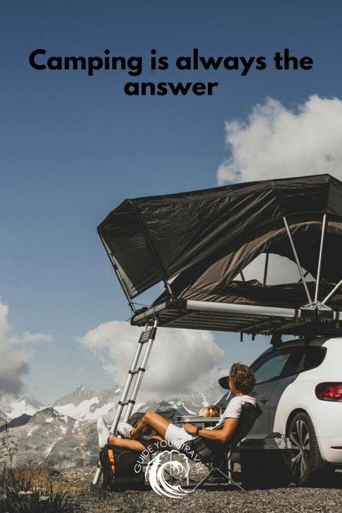 A person camping by a car in the mountains camping instagram captions and quotes.