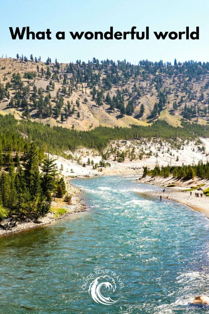 A river flows through a forested landscape in Yellowstone perfect for instagram captions and quotes