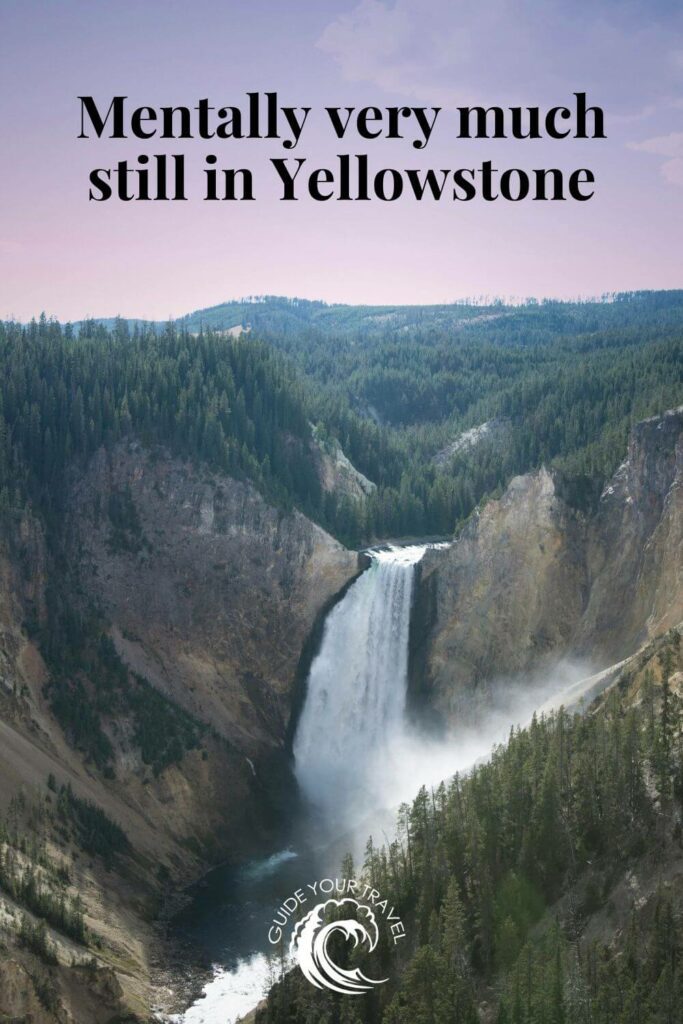 A waterfall in a forested canyon in Yellowstone perfect for instagram captions and quotes