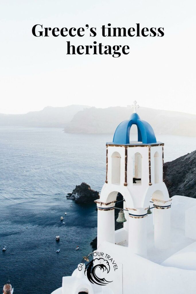 White bell tower with a blue dome by the sea perfect for Greece Instagram Captions and Quotes