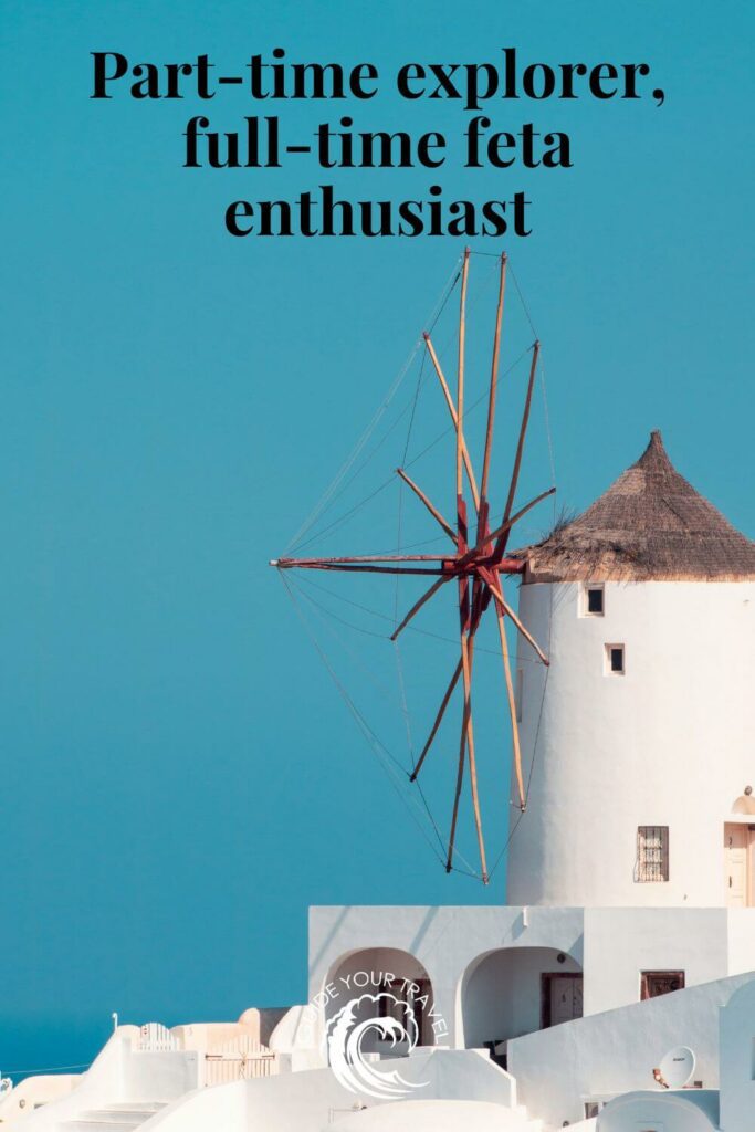 A white windmill against a blue sky perfect for Greece Instagram Captions and Quotes