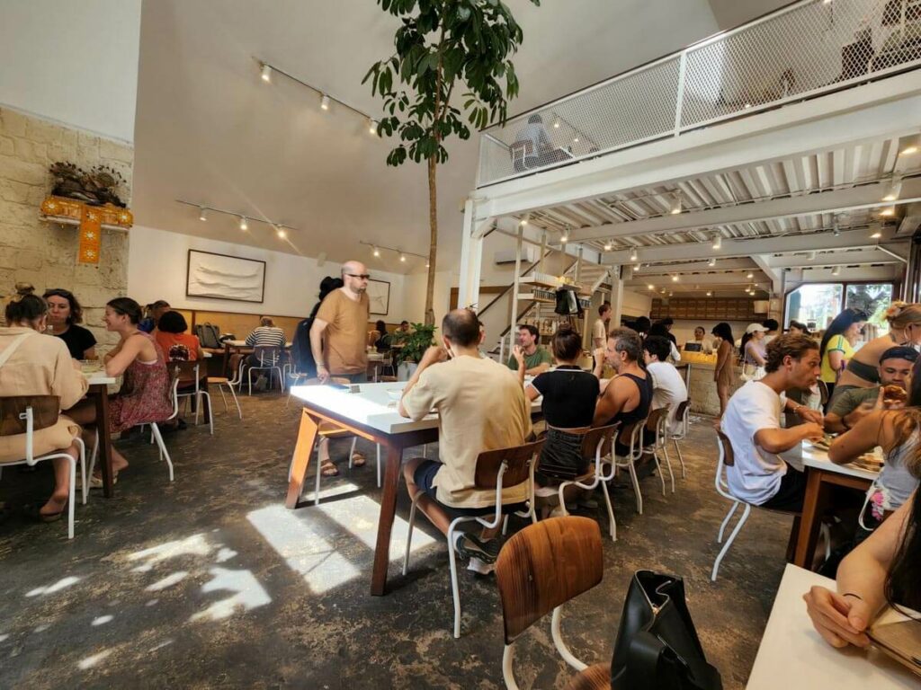 Baked interior of the restaurant with people