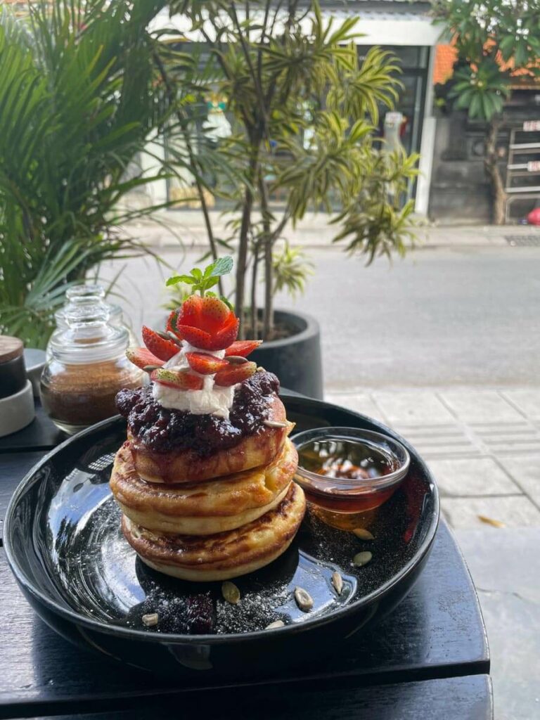 Ruko Cafe pancake stack at table outside