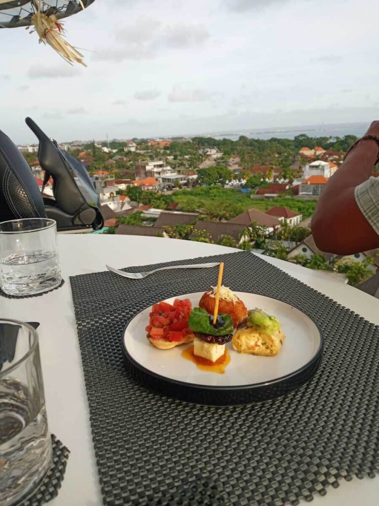 Lounge in the Sky plate on table with view at one of the best unique and unusual restaurants in Bali